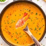 Overhead photo of a Dutch oven filled with lobster bisque.