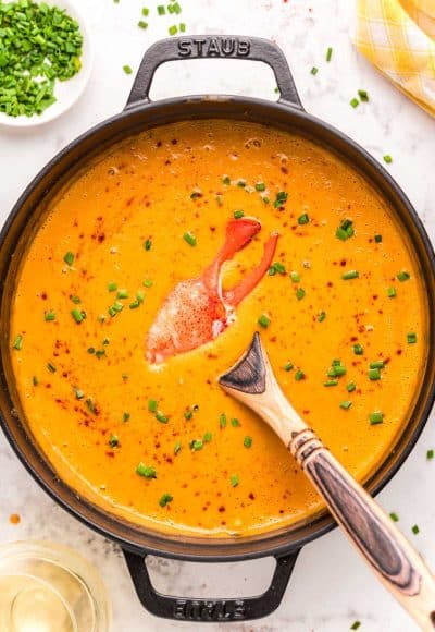 Overhead photo of a Dutch oven filled with lobster bisque.