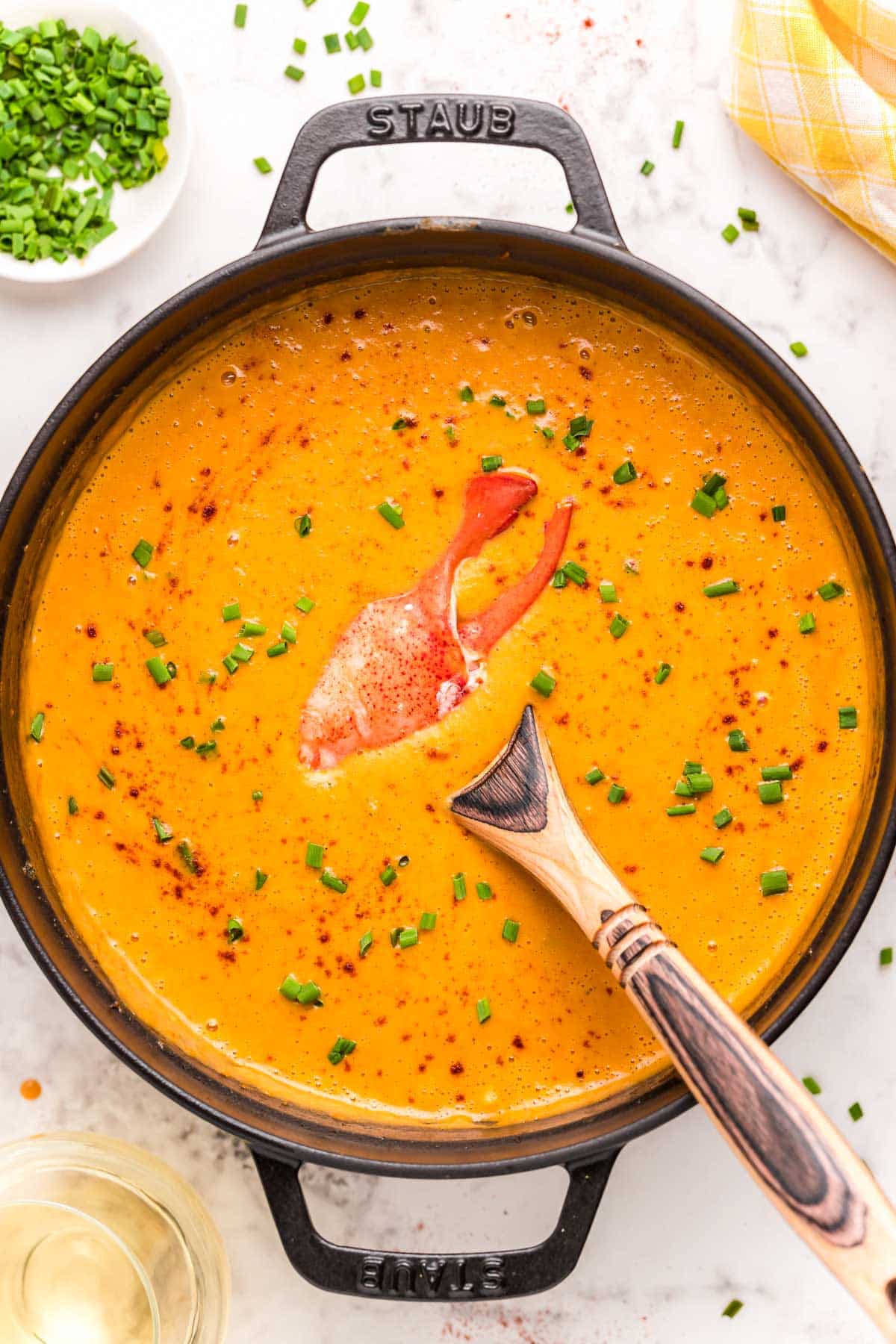 Overhead photo of a Dutch oven filled with lobster bisque.