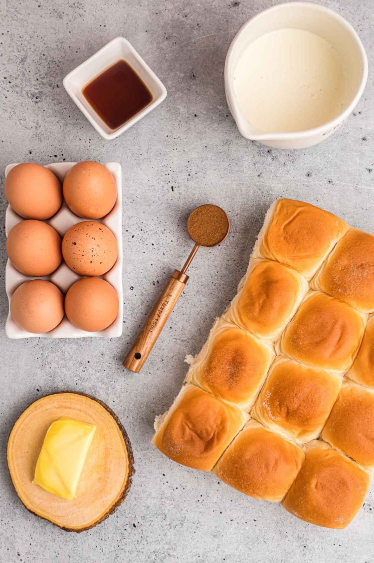 Ingredients to make french toast sliders on a gray surface.