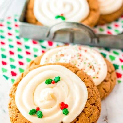 Big and chewy gingerbread cookies on a white marble surface.