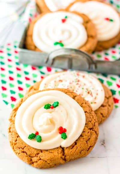 Big and chewy gingerbread cookies on a white marble surface.