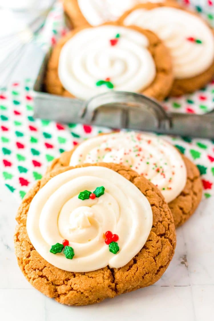 Big and chewy gingerbread cookies on a white marble surface.