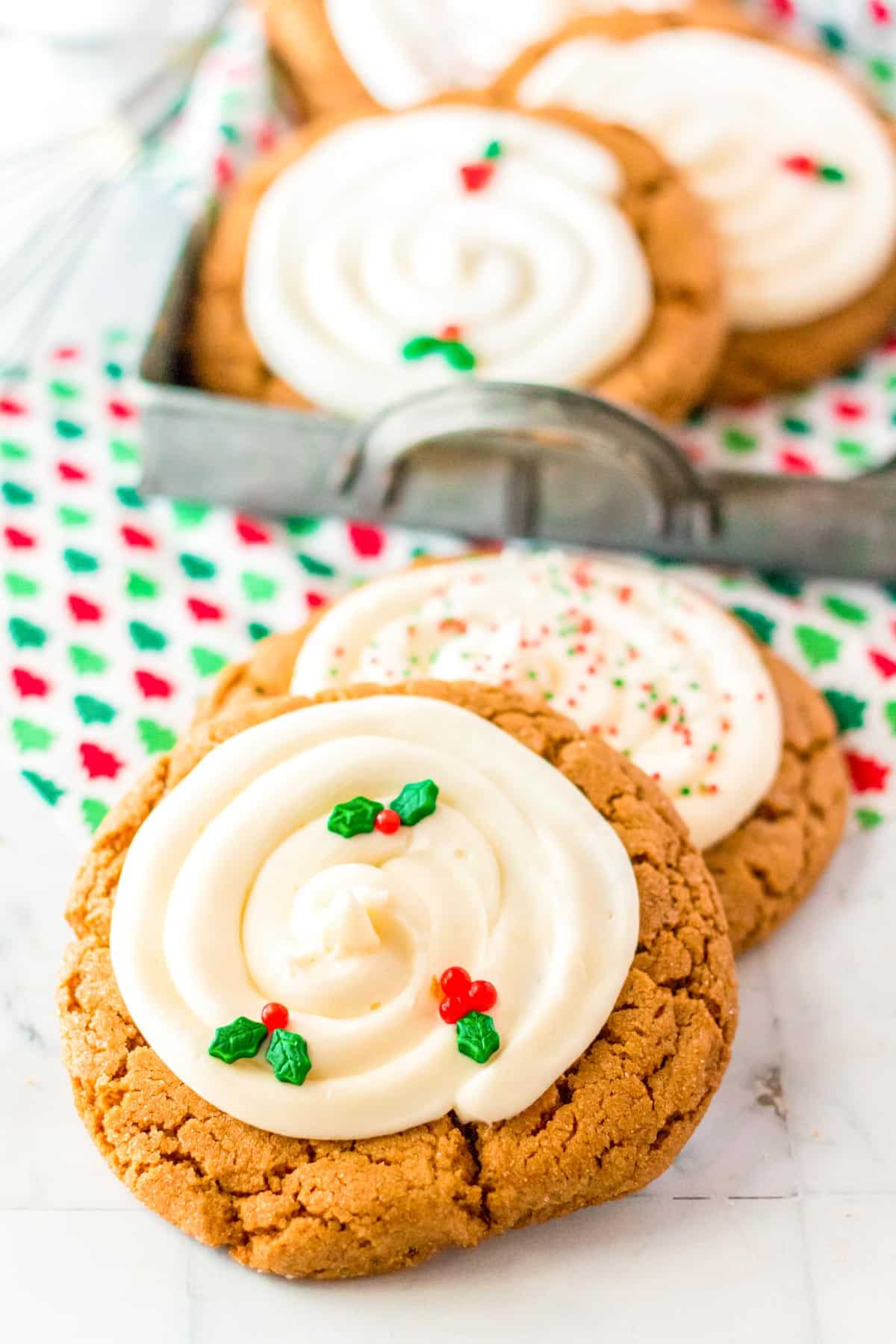 Big and chewy gingerbread cookies on a white marble surface.