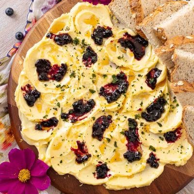 Overhead photo of a butter board on a floral napkin.