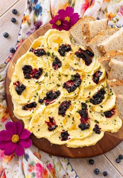 Overhead photo of a butter board on a floral napkin.