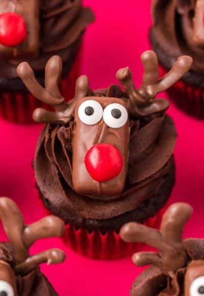 Close up of chocolate cupcakes decorated like reindeer.