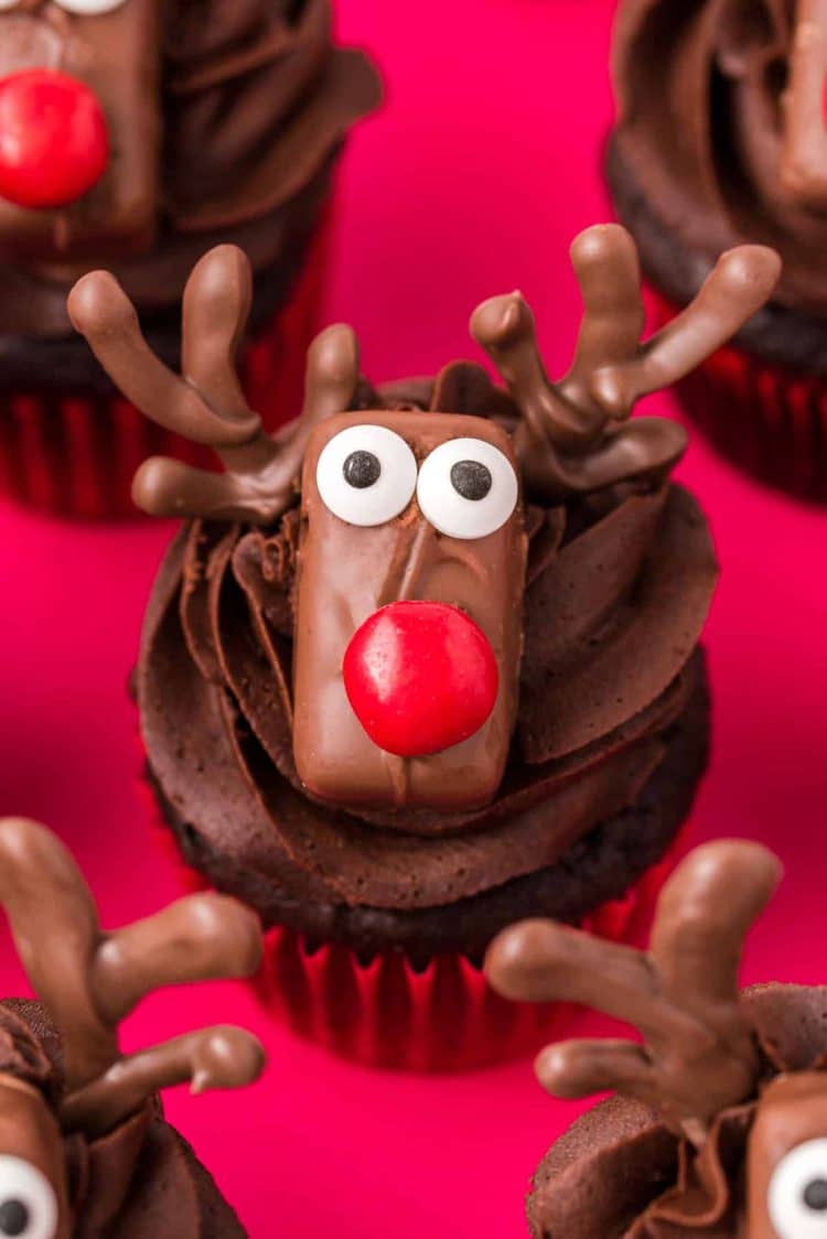 Close up of chocolate cupcakes decorated like reindeer.
