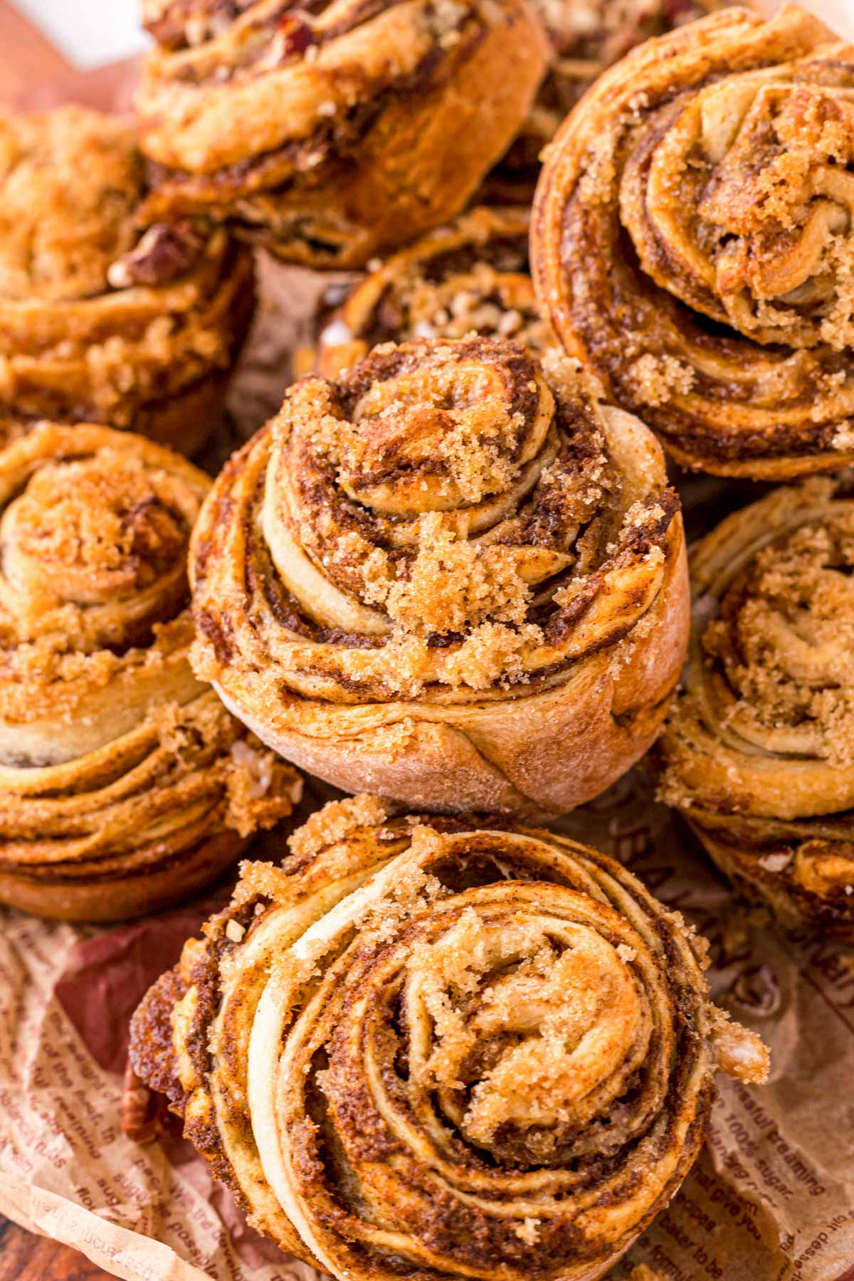 Pumpkin Cinnamon Roll Muffins piled on top of each other.