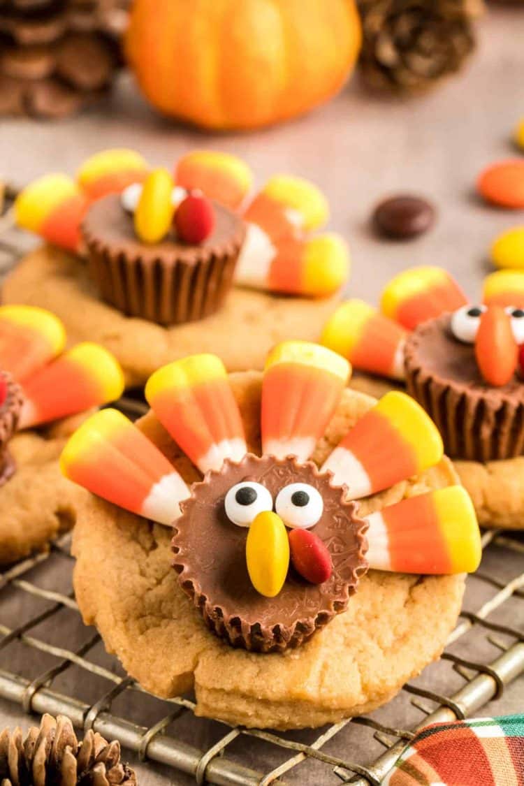 Close up photo of peanut butter cookies decorated as turkeys with candy.