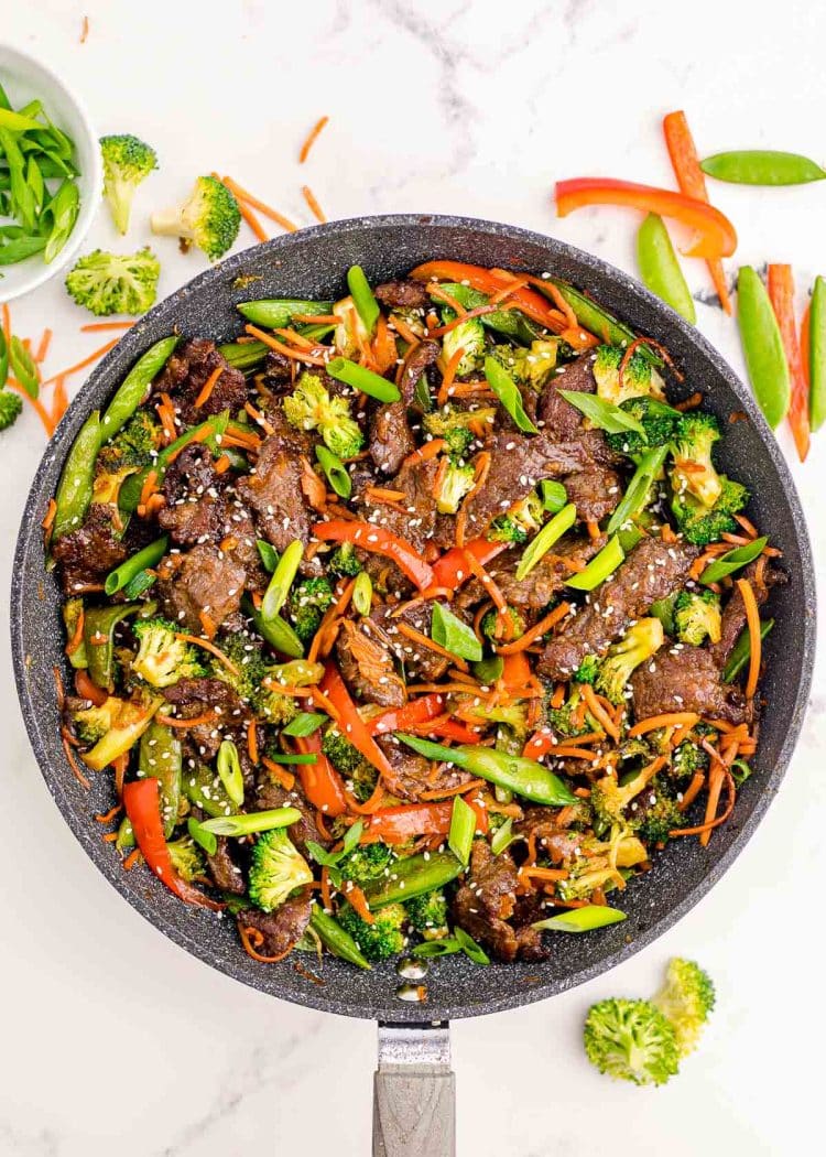 Overhead photo of beef stir fry in a skillet.