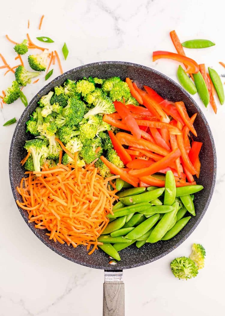 Vegetables cut up in a pan.