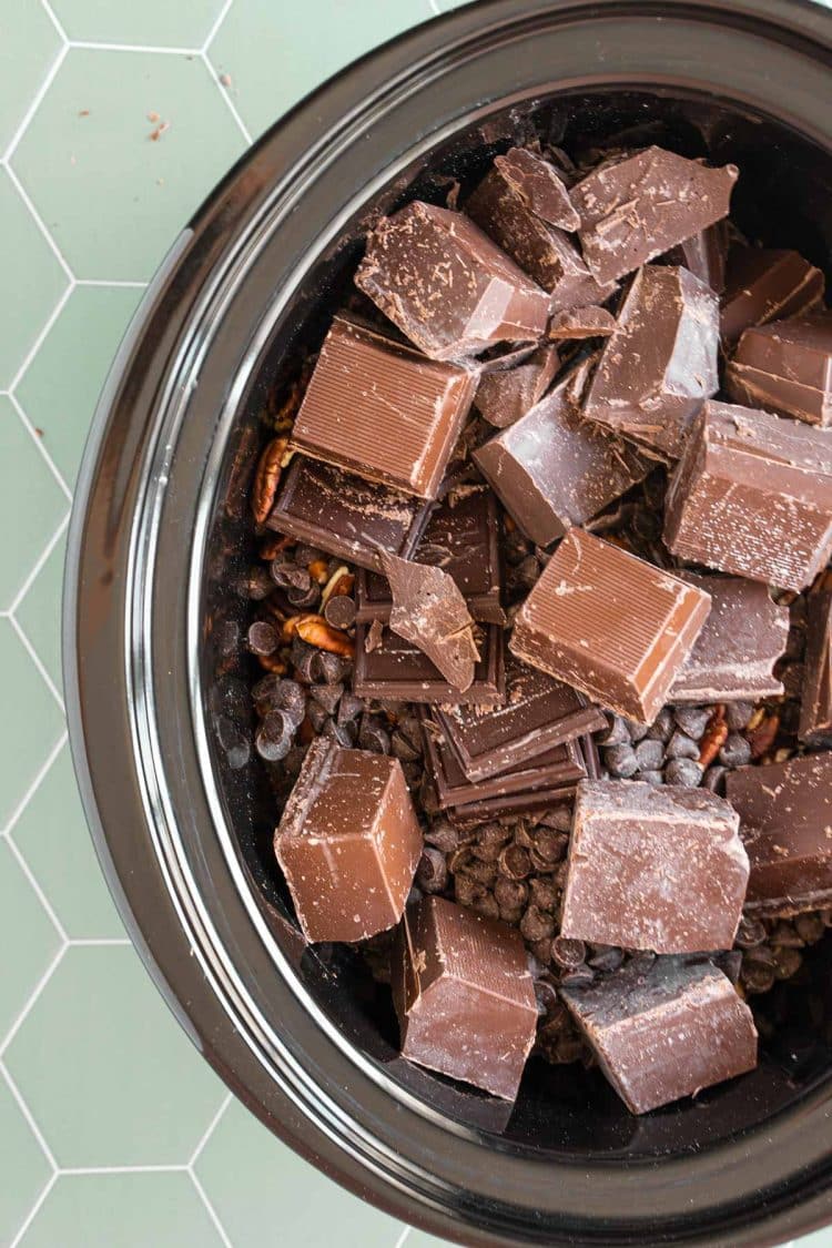 Turtle candies being made in the crockpot.