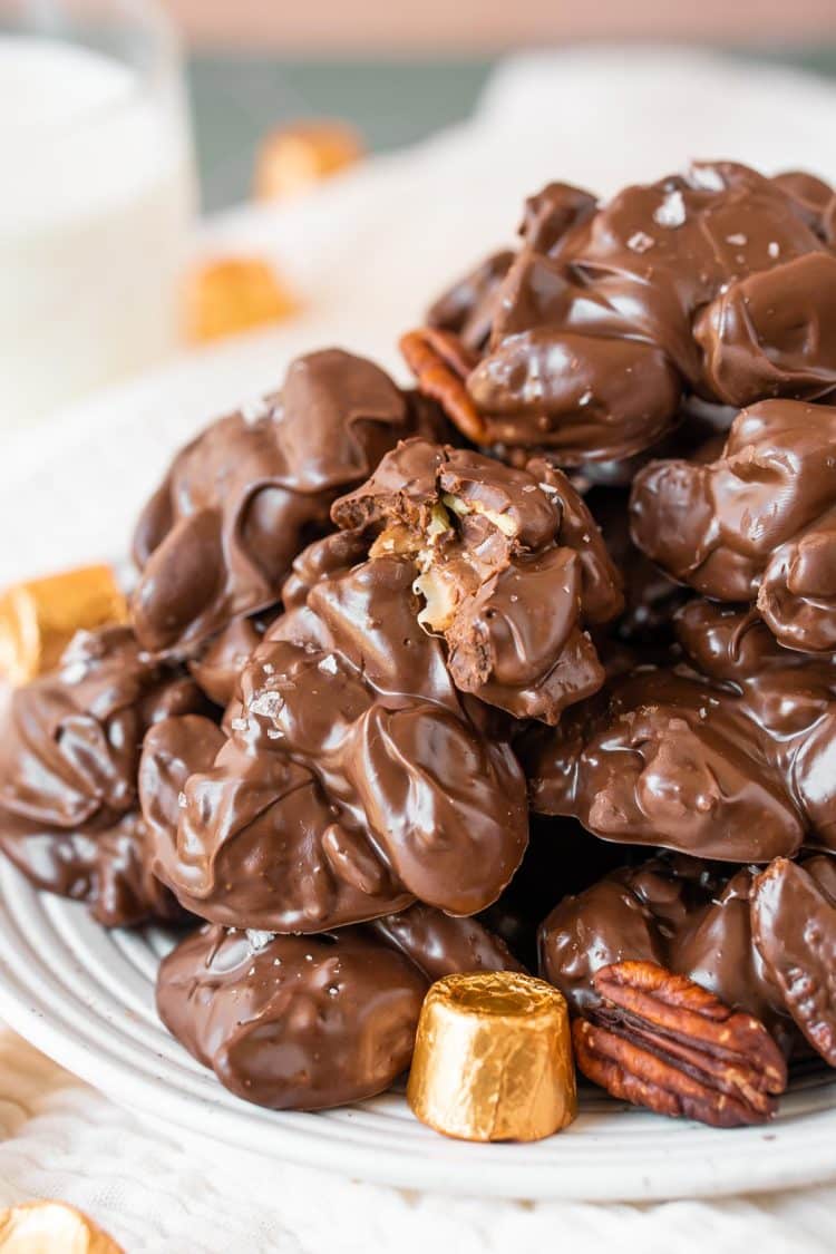 Turtle crockpot candies on a white plate.