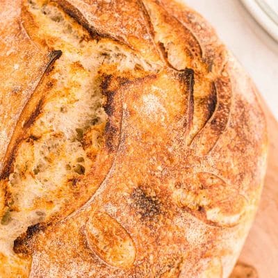 Overhead close up of a loaf of sourdough bread.