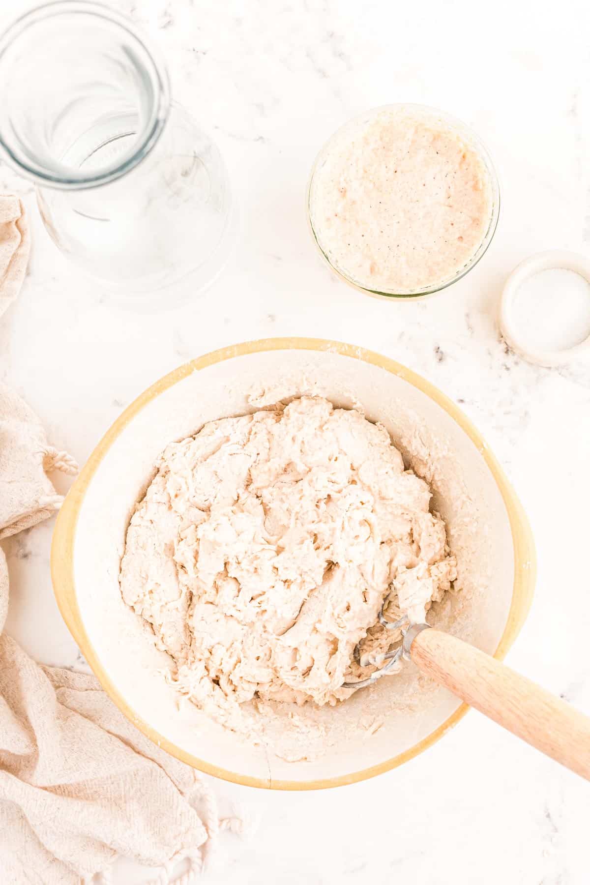 Water and flour mixed together in a bowl.