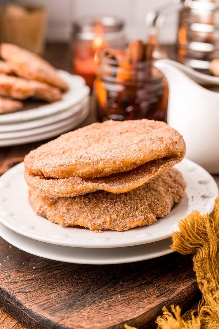 Three Mexican Bunuelos on a white plate.