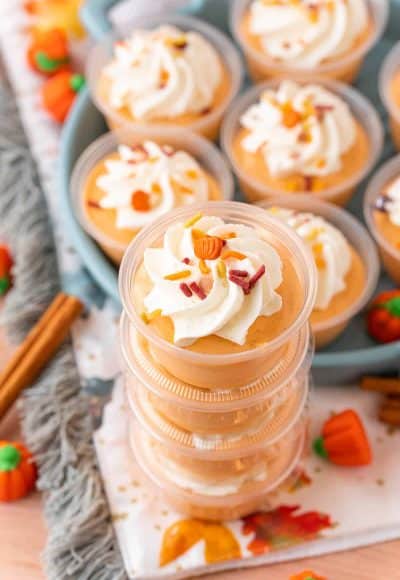 Pumpkin spice pudding shots stacked.