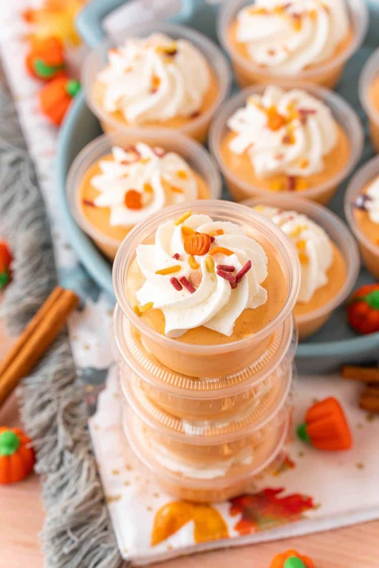 Pumpkin spice pudding shots stacked.