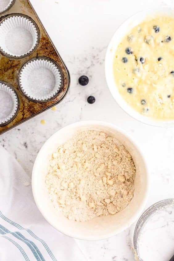 Streusel being made in a bowl.