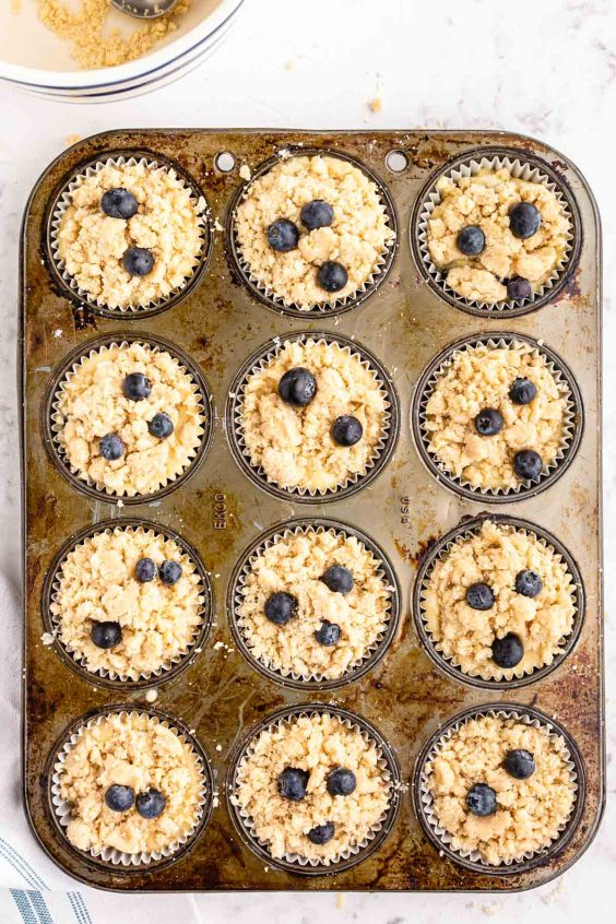 Blueberry muffins in a pan ready to bake.