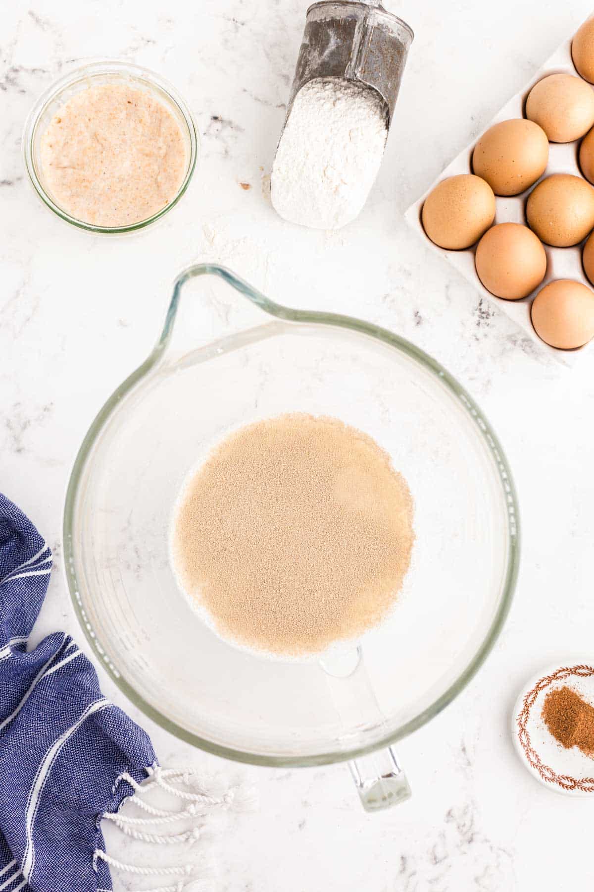 Yeast blooming in a mixing bowl.