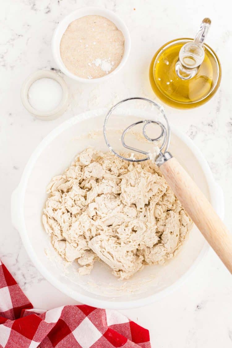 Dough being mixed with a bread hook.