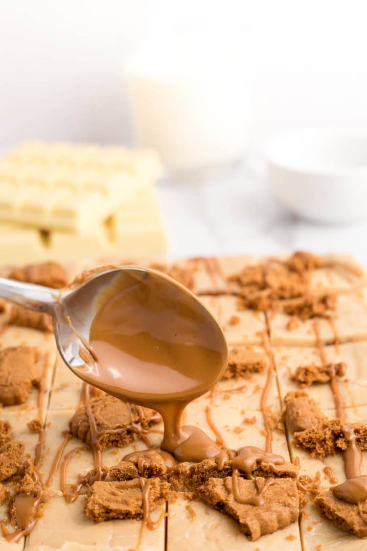 Biscoff spread being drizzled over fudge.