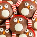 Close up photo of Oreo Penguin Cookies piled on a white plate.