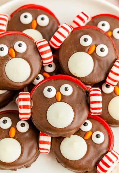 Close up photo of Oreo Penguin Cookies piled on a white plate.