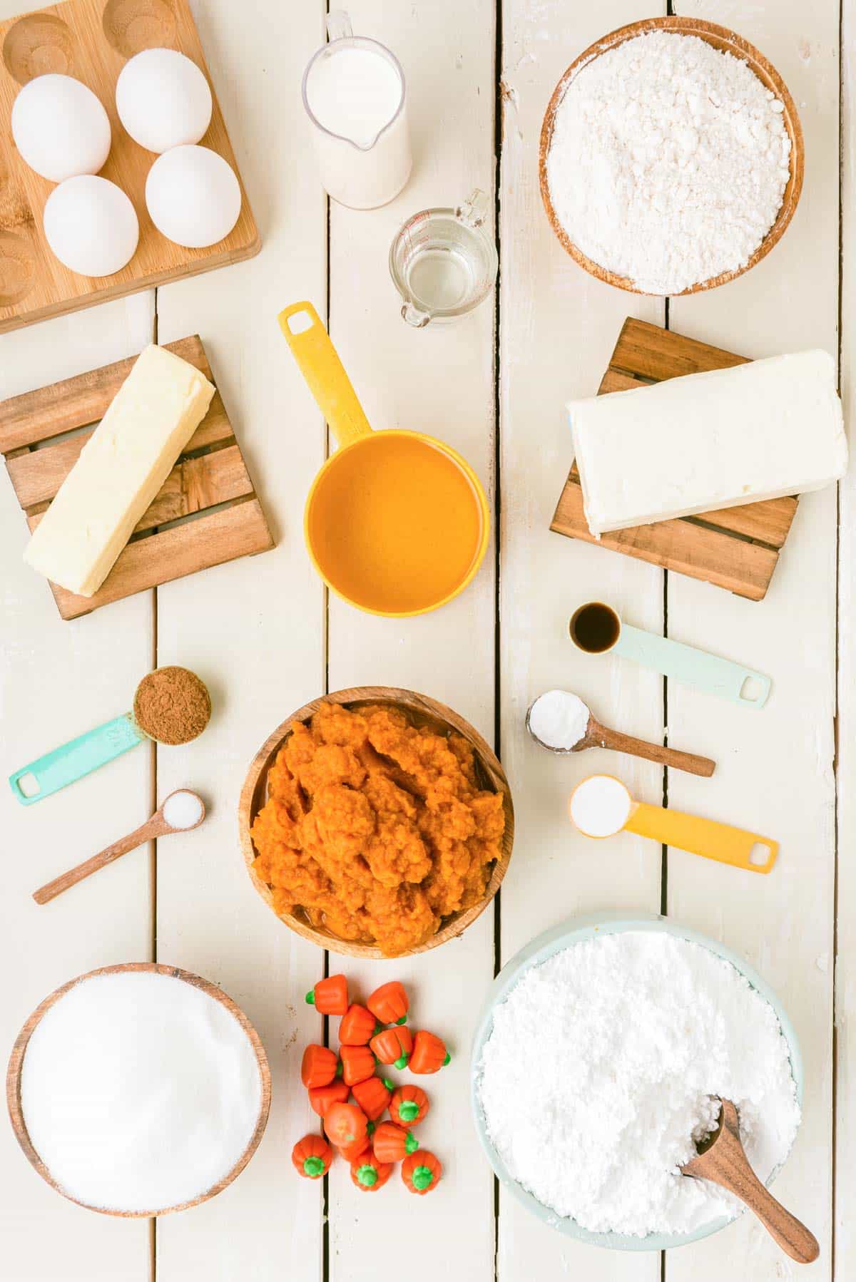 Overhead photo of ingredients to make pumpkin cake on a table.