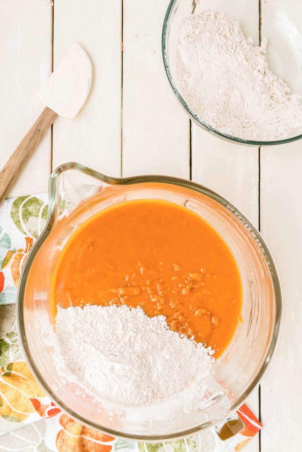 Pumpkin cake batter being made in a bowl.