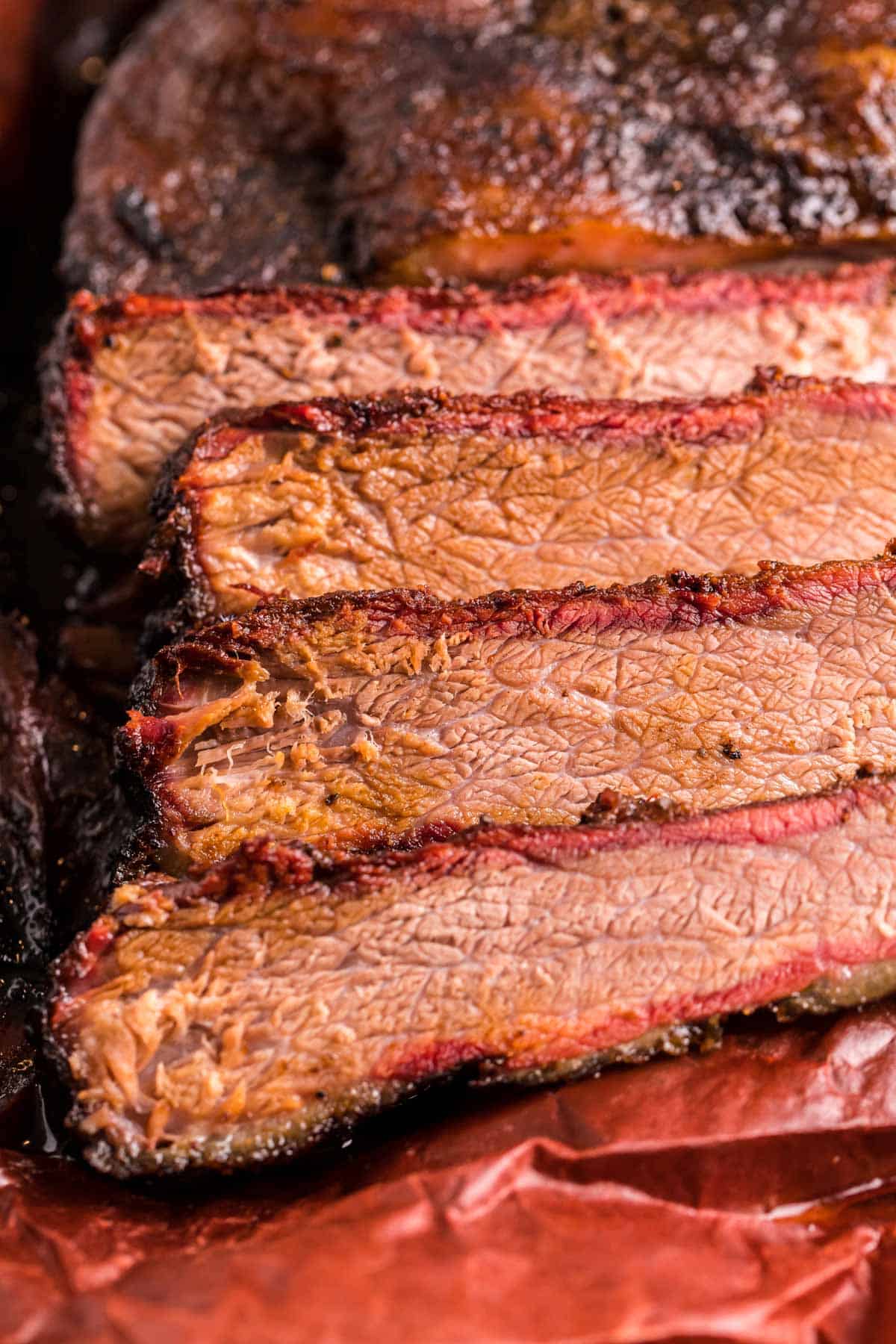 Close up of sliced smoked beef brisket.