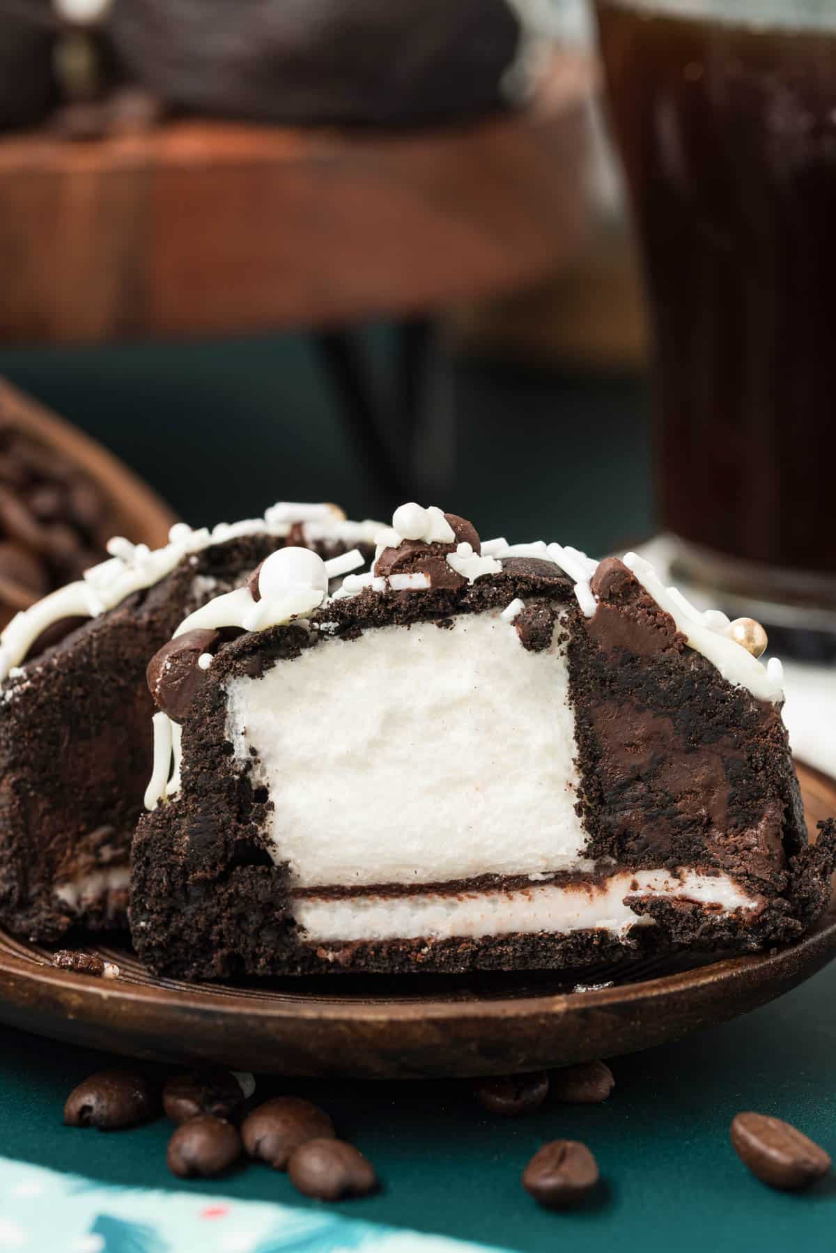 A peppermint mocha cookies stuffed with marshmallow and peppermint patty sliced open to show the inside.