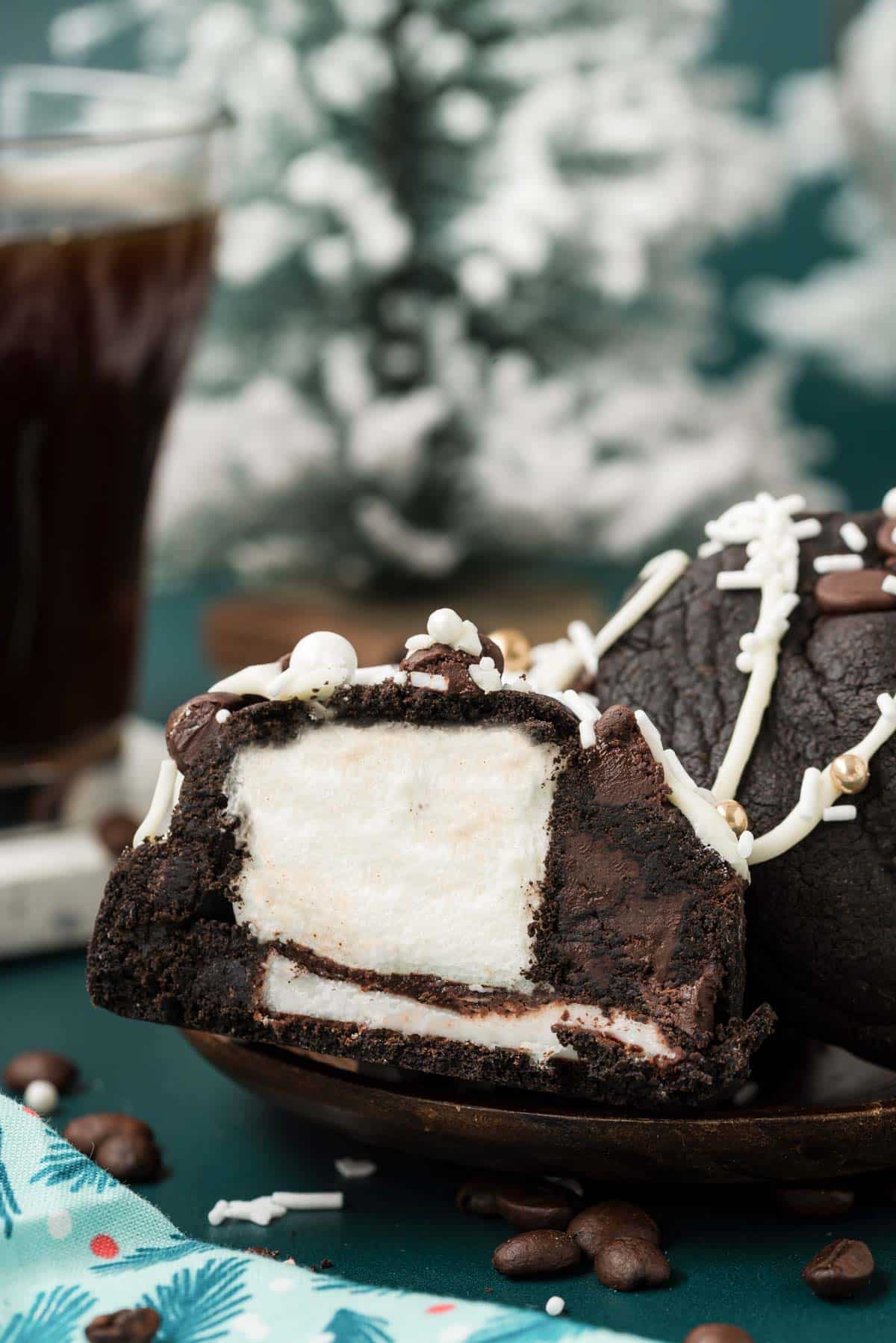 A peppermint mocha cookies stuffed with marshmallow and peppermint patty sliced open to show the inside.