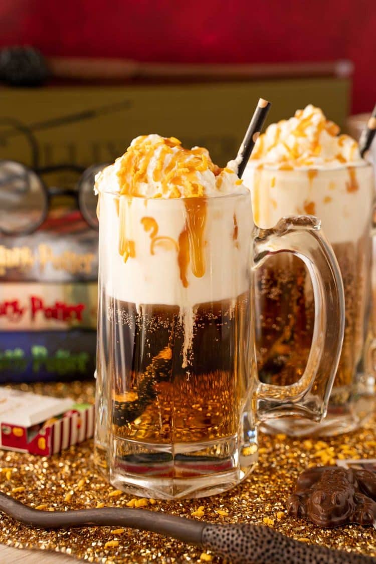 Close up of a beer mug filled with butterbeer dirty soda.