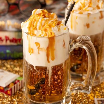 Close up of a beer mug filled with butterbeer dirty soda.