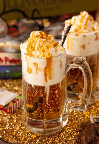 Close up of a beer mug filled with butterbeer dirty soda.