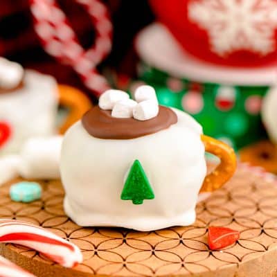 Hot Cocoa Oreo Ball on a wooden coaster.