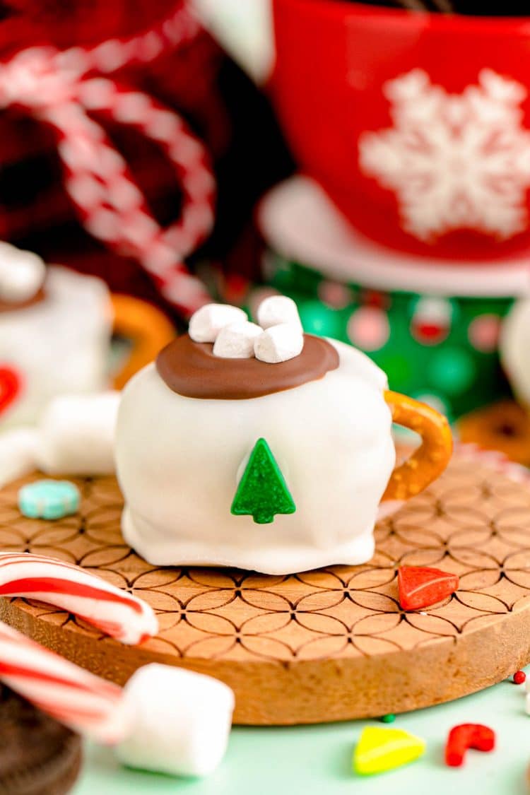 Hot Cocoa Oreo Ball on a wooden coaster.