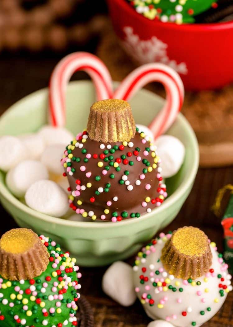 Christmas Ornament Oreo Balls on a wooden table.