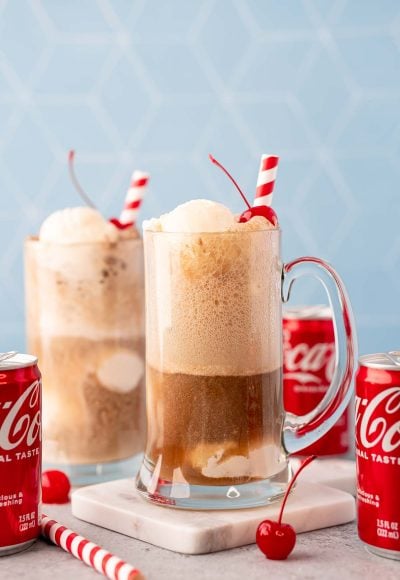 A glass stein filled with a coke float.