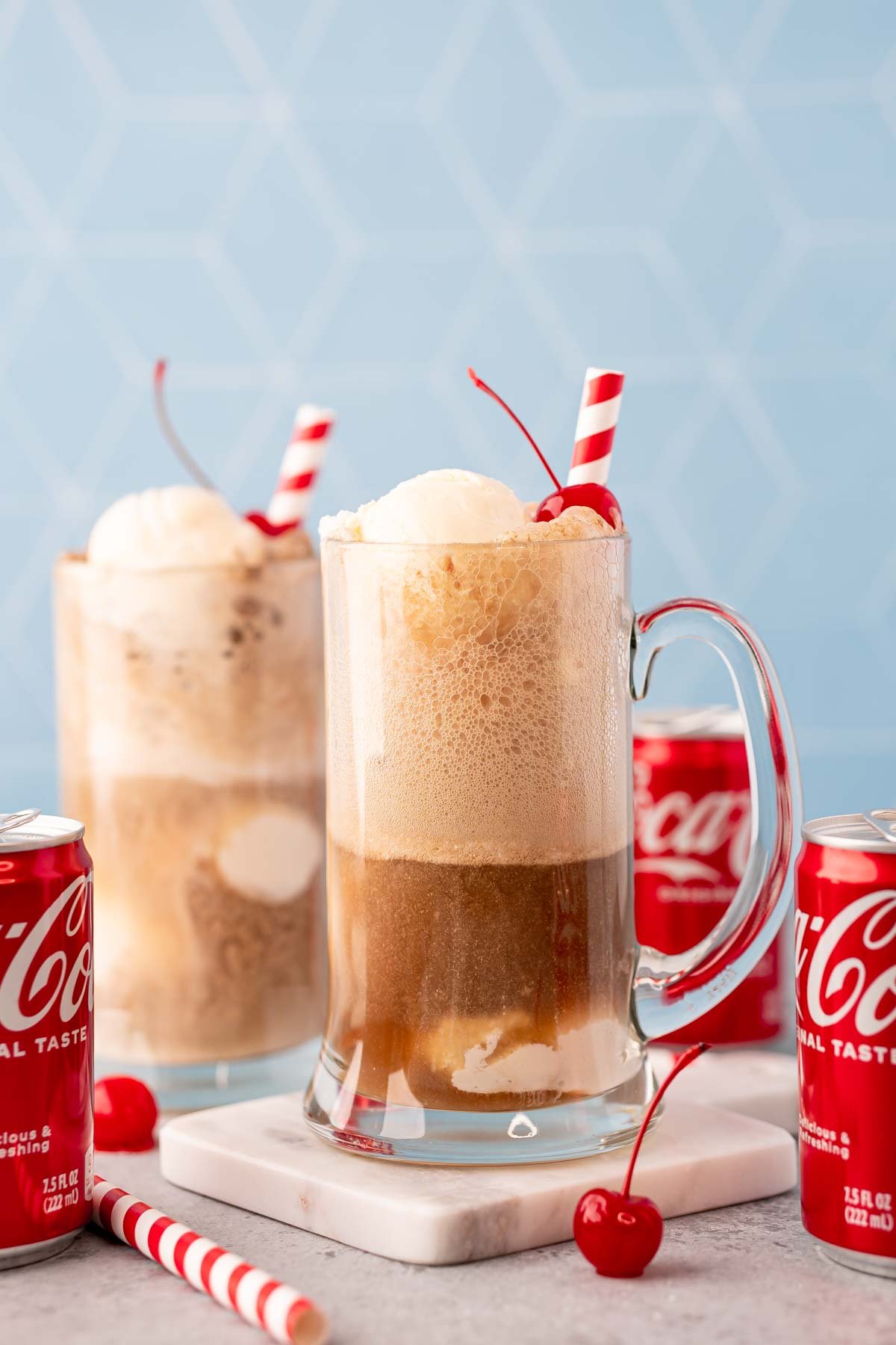 A glass stein filled with a coke float.