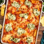 Overhead photo of sheet pan lasagna on a wooden table.