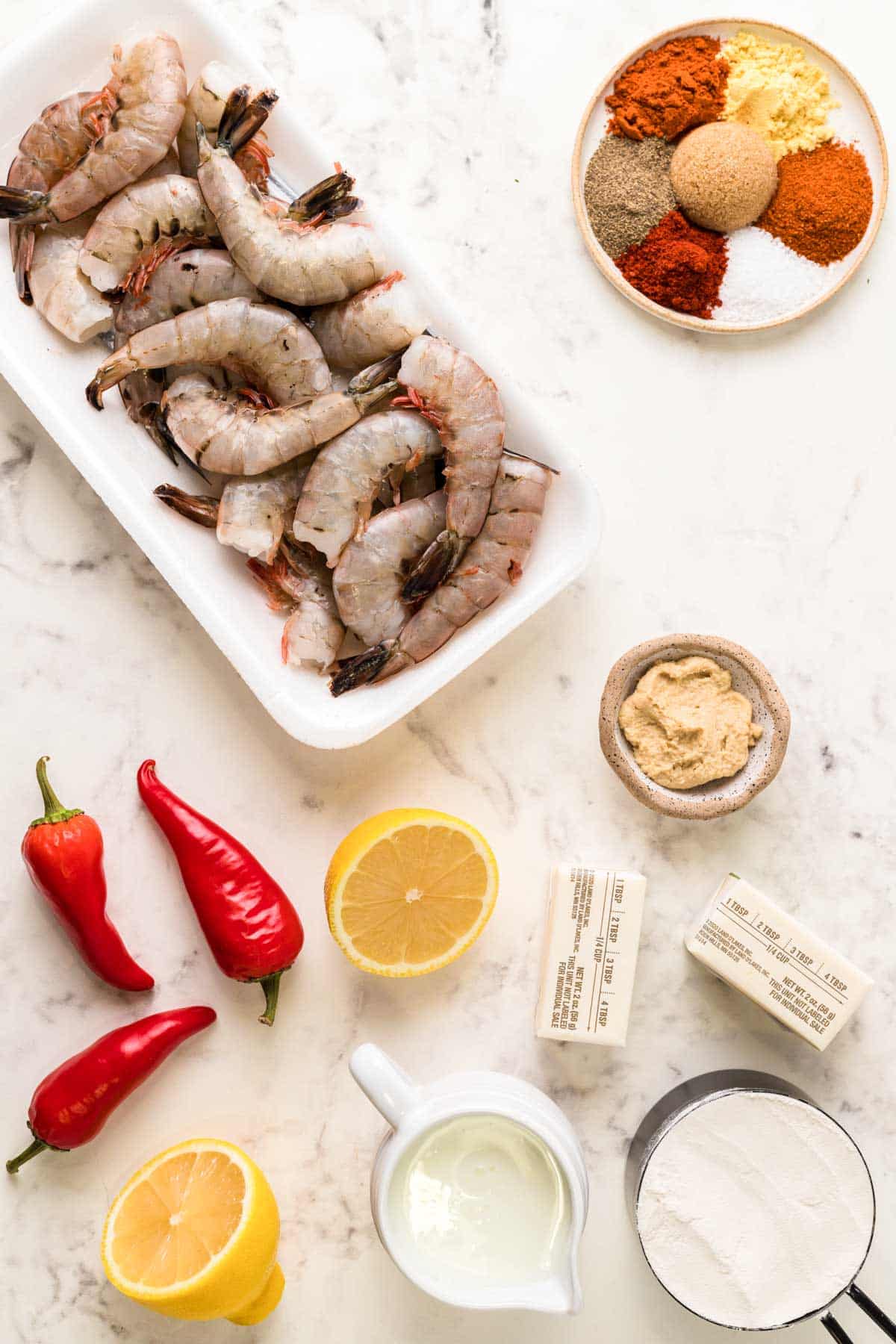 Overhead photo of ingredients to make wild west shrimp on a marble counter.