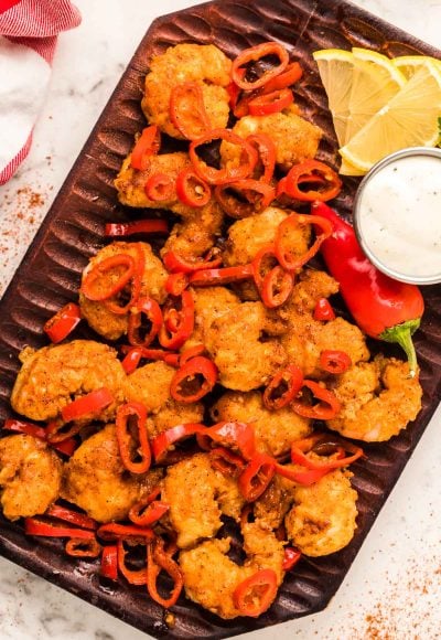 Overhead photo of Longhorn Wild West Shrimp copycat recipe on a wooden plate.