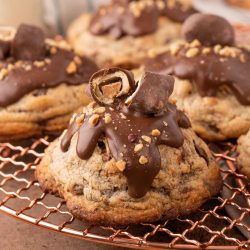 Close up of a chubby hubby cookies on a copper wire rack.