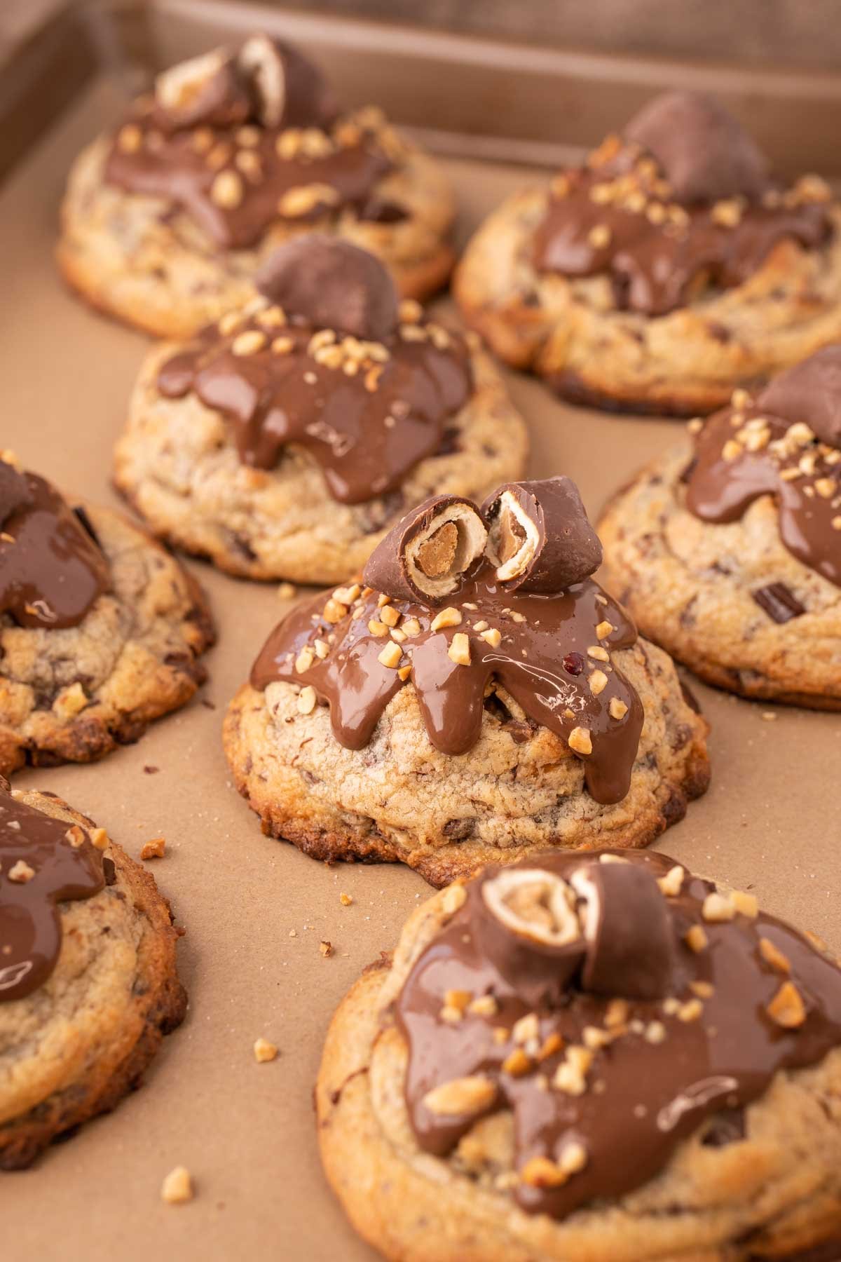 Gourmet Chubby Hubby Cookies on a parchment lined baking sheet.