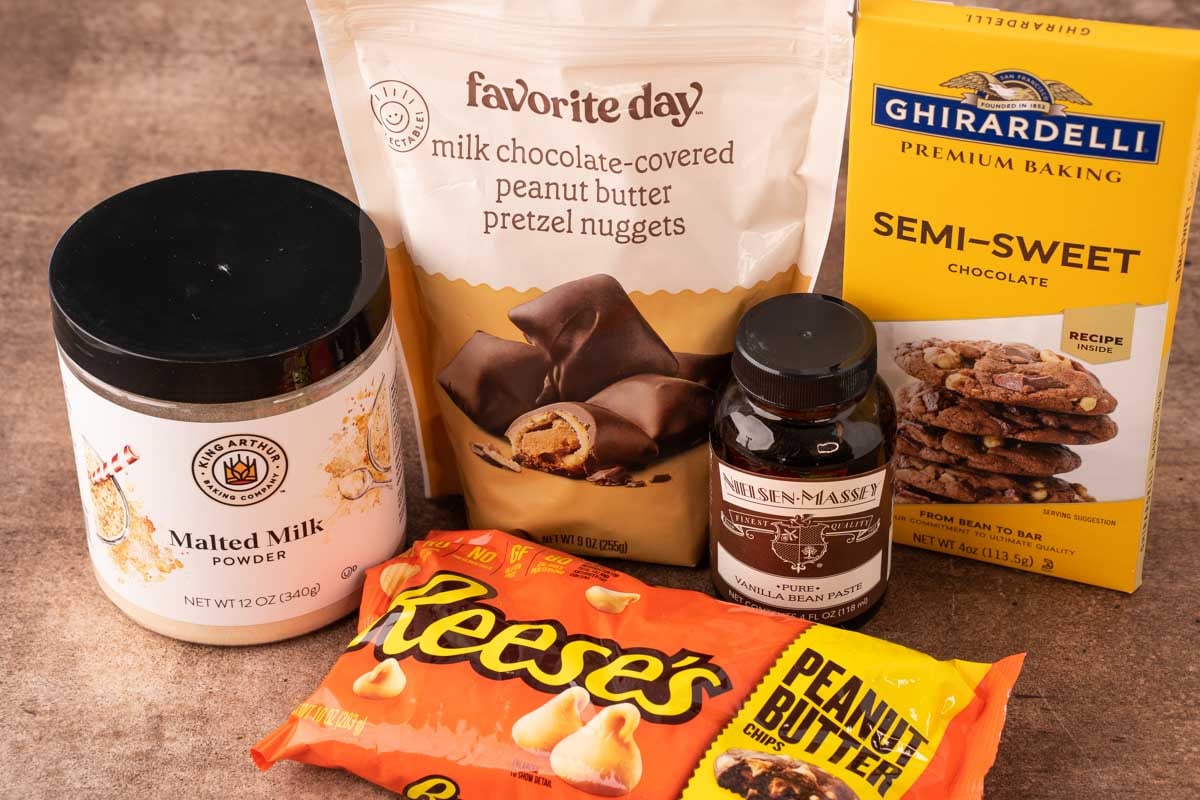 Ingredients to make chubby hubby cookies on a brown counter top.