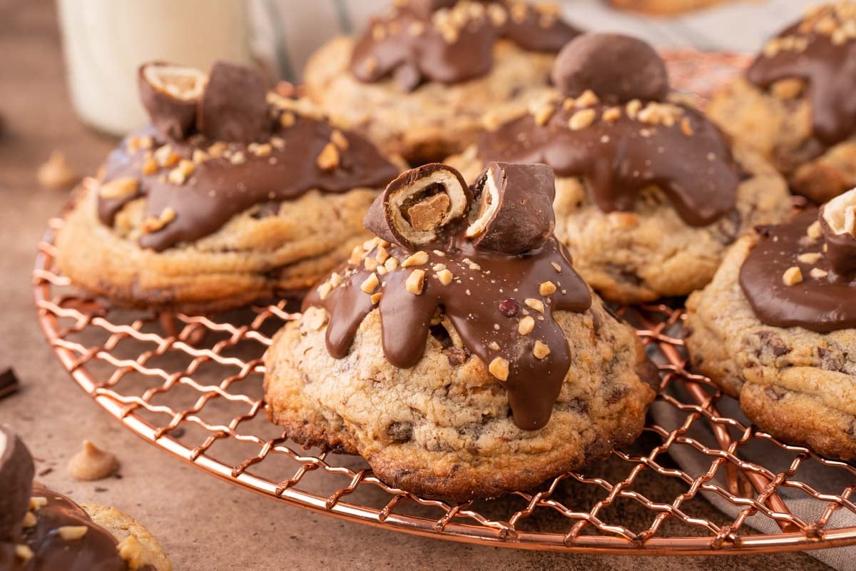 Close up of a chubby hubby cookies on a copper wire rack.